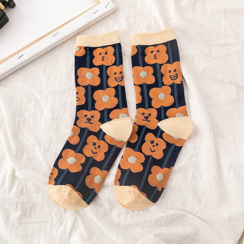 JoyPop Patterned Socks in black with orange flowers front picture