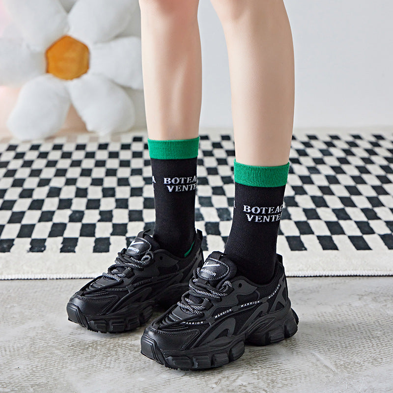 Vivid green Crew Socks in black on runner