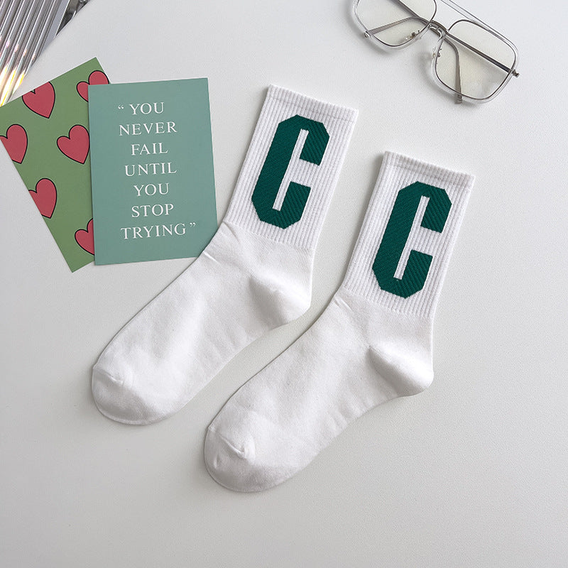 Vivid green Socks in white with C letter as logo front picture