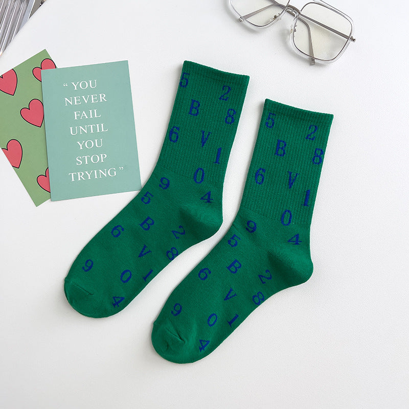 Vivid green Socks in darkgreen with random letters on socks