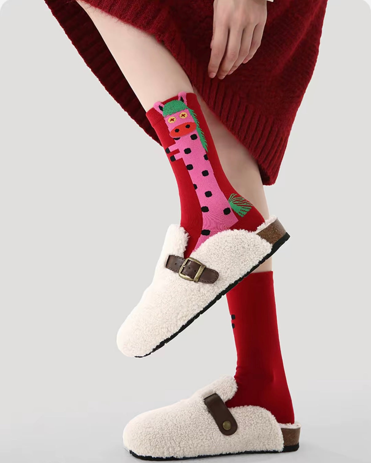 Year of Horse socks pack featuring three red socks with playful horse designs in purple, green, and pink