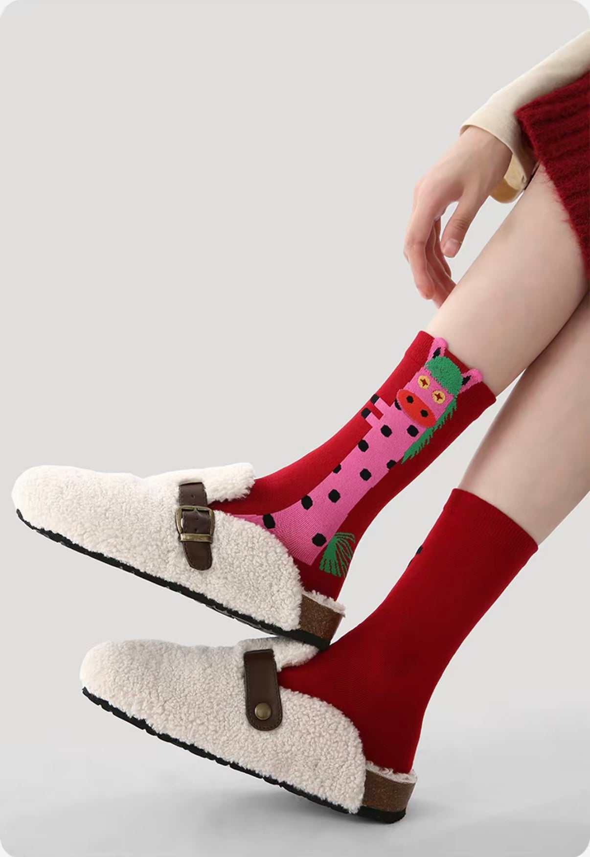 Year of Horse socks pack featuring three red socks with playful horse designs in purple, green, and pink