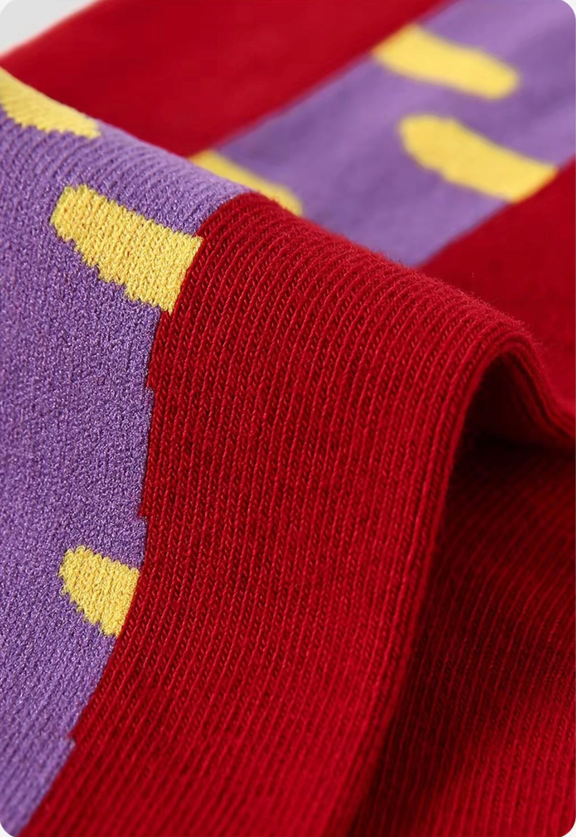 Year of Horse socks pack featuring three red socks with playful horse designs in purple, green, and pink